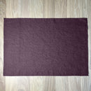 Aubergine-linen-placemat-on-wooden-table